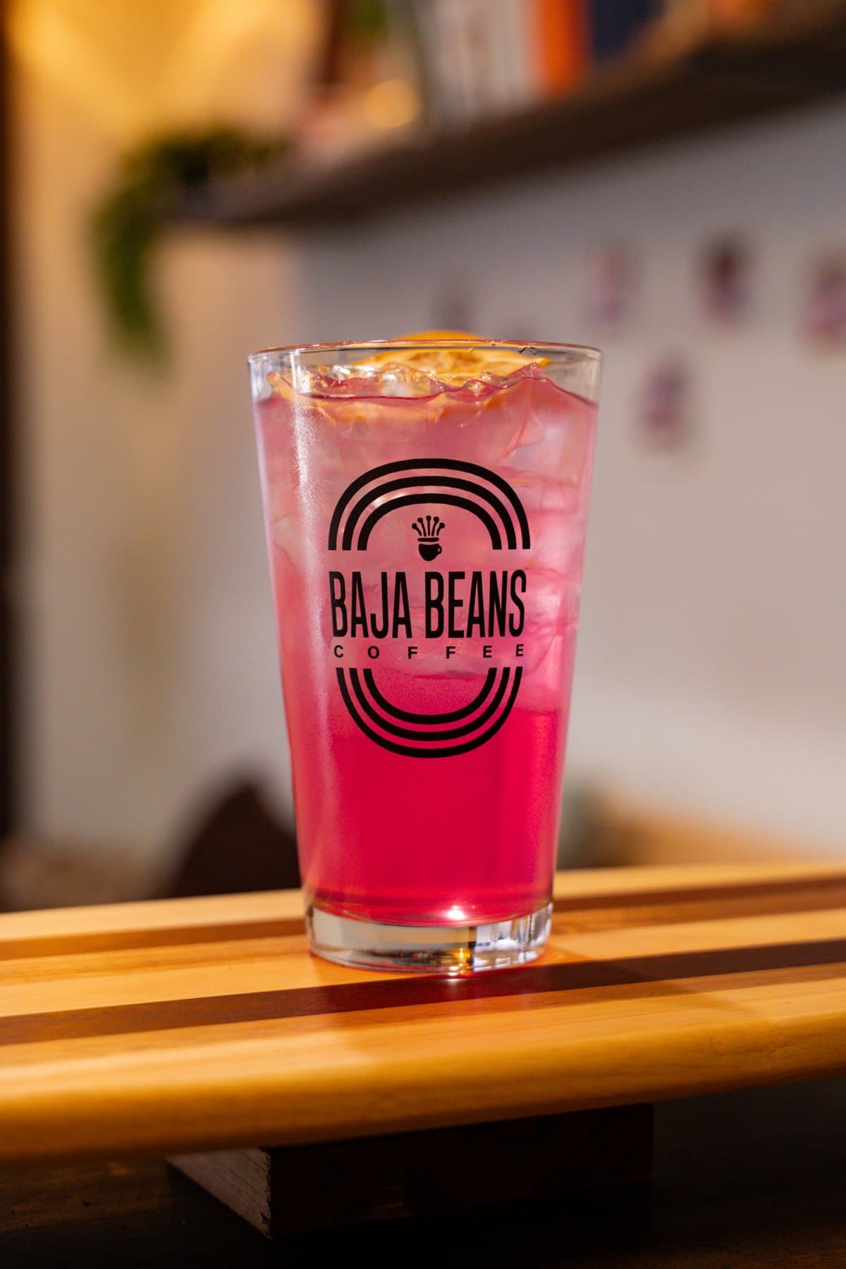 Prickly Pear Cooler, bright pink over ice in a Baja Beans glass